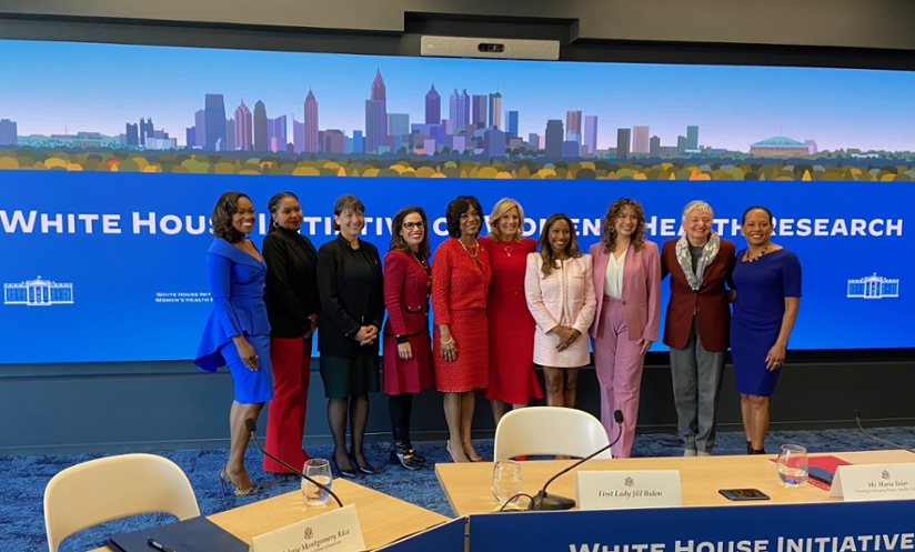 Tene Lewis poses with Jill Biden and other roundtable speakers